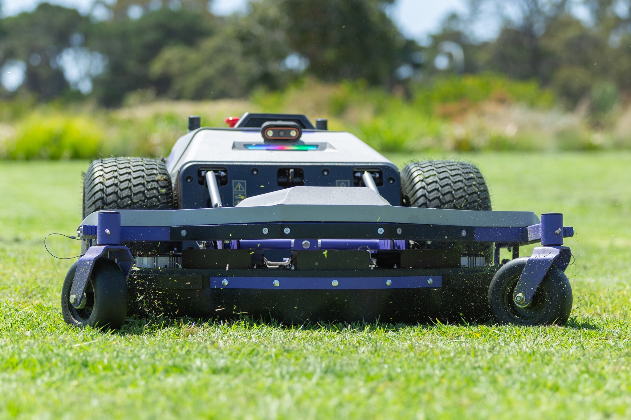 Autonomous robotic mower operating on grass